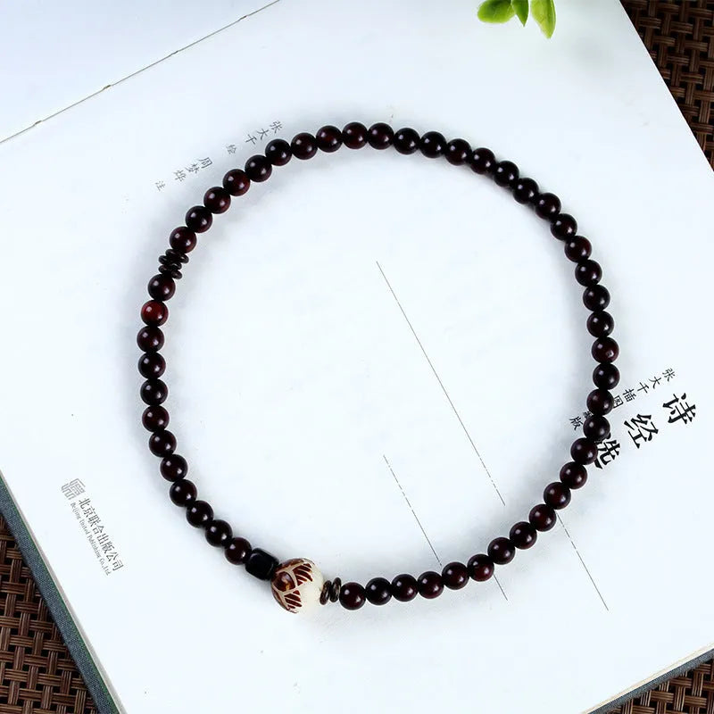 Natural rosewood double-ring bracelet with retro flower design, 10mm size, showing double circle pattern