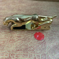Car Leopard brand rotatable mobile phone holder in black on a car dashboard.