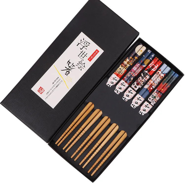Set of Japanese-style patterned bamboo chopsticks showing lucky cat and elegant blue designs with gift box packaging