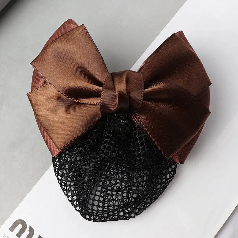 Professional hair clip with a black net pocket and a red flower bow ornament on a white background.