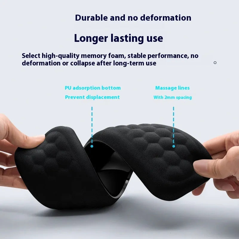 Customisable memory foam mouse wrist pad with black cloth cover on a desk.