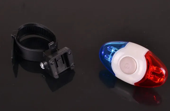 Red and blue LED bicycle tail light with adjustable mounting base in horizontal and vertical positions