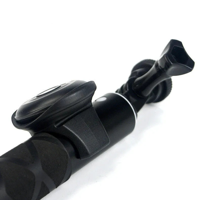 Black Snap Bluetooth remote control for wireless smartphone camera shutter, shown on a white background.