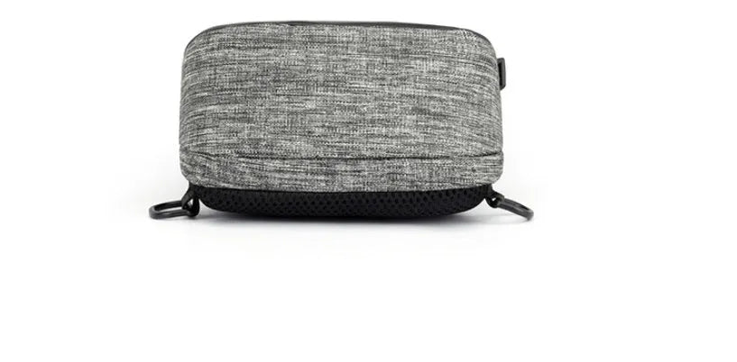 Small dark blue oxford cloth waterproof chest bag with a single strap and zipper.