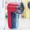 Compact handheld electric lint remover depiller with plastic housing and stainless steel blades