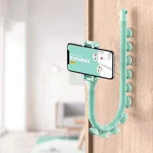 Flexible black rubber phone holder with suction cup extended, showing 360° rotation joint next to a mobile phone.