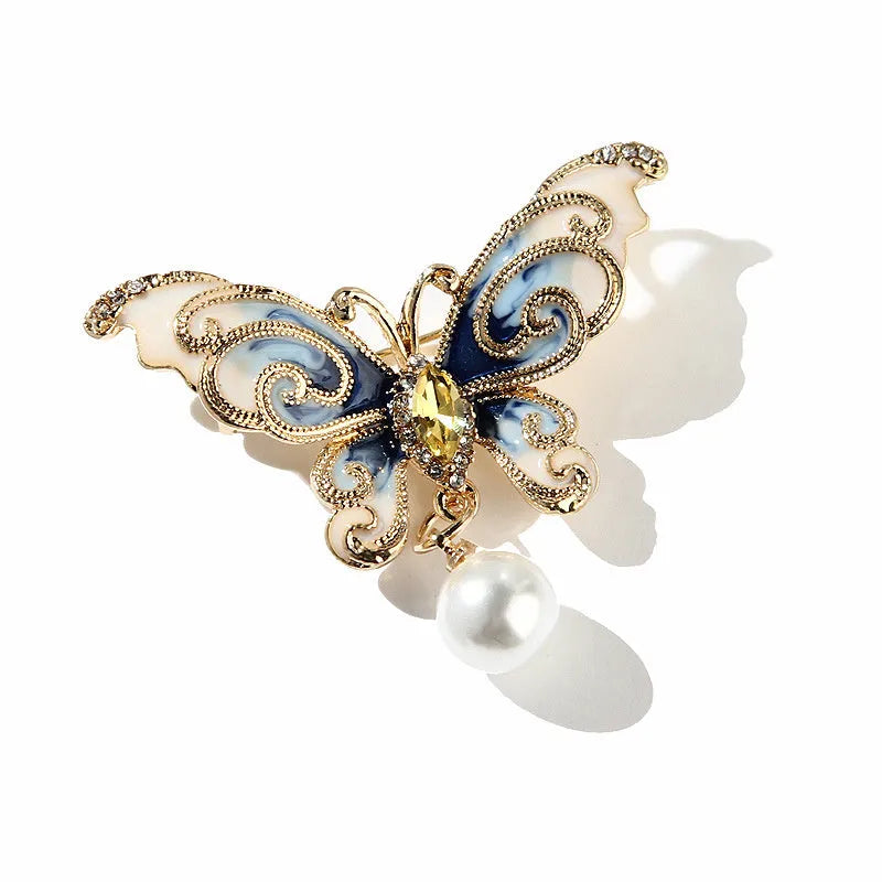 European and American style butterfly brooch in zinc alloy with artificial gems in blue, green, and red colours