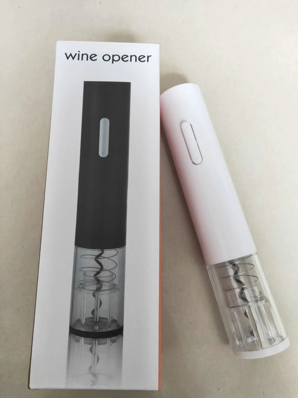 Automatic electric wine bottle opener with foil cutter in black, showing compact design and button operation
