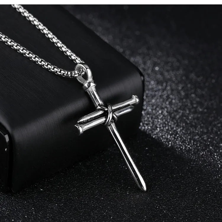 Titanium steel cross pendant necklace with steel nails motif, available in black golden silver colours