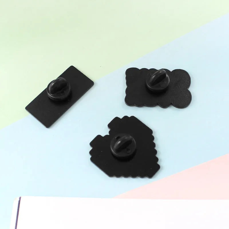 Alloy metal stereo game console badge with embossed design in multiple colour options
