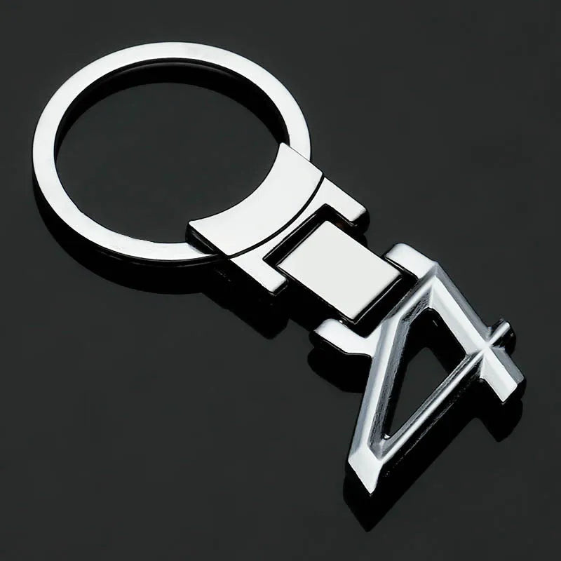 Zinc alloy metal keychain 67mm long on a wooden surface with a set of keys attached