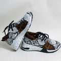 Women's casual suede sneakers with wedge heel in black, leopard, panther, pink, and snake pattern colours