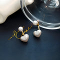 Korean style women's heart-shaped pearl stud earrings with artificial gemstone inlay on alloy base