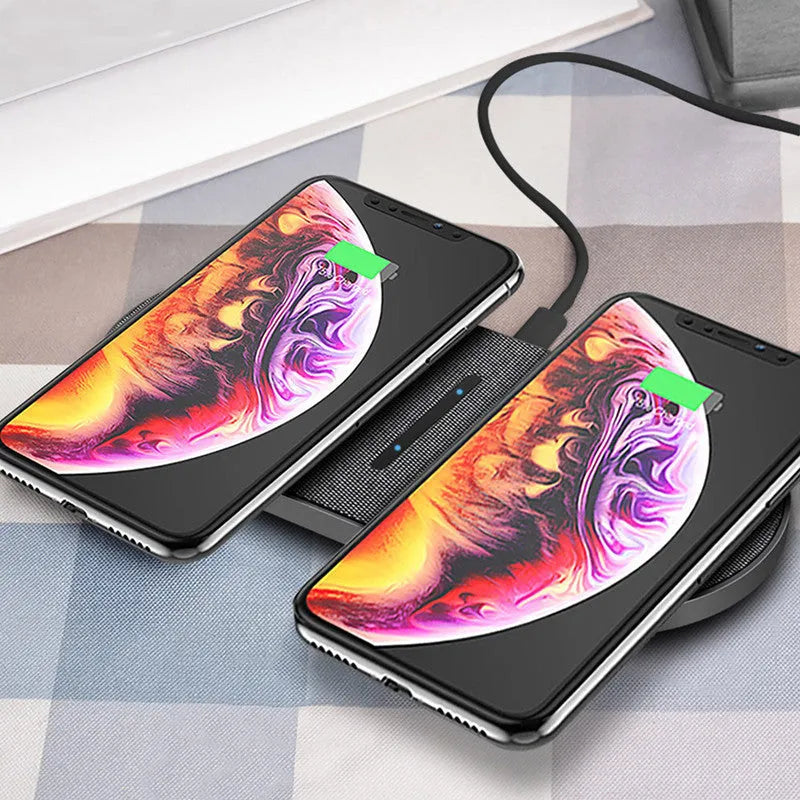 Black 10W dual wireless charging pad set with LED lights, shown charging two smartphones.