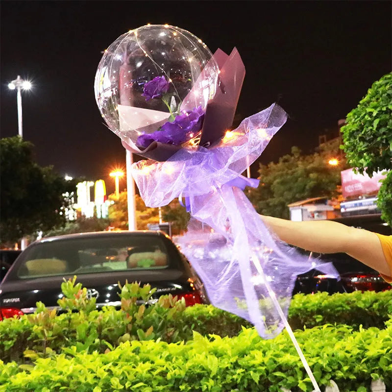 Transparent LED luminous balloon with artificial rose and built-in light, shown as a DIY bouquet kit.