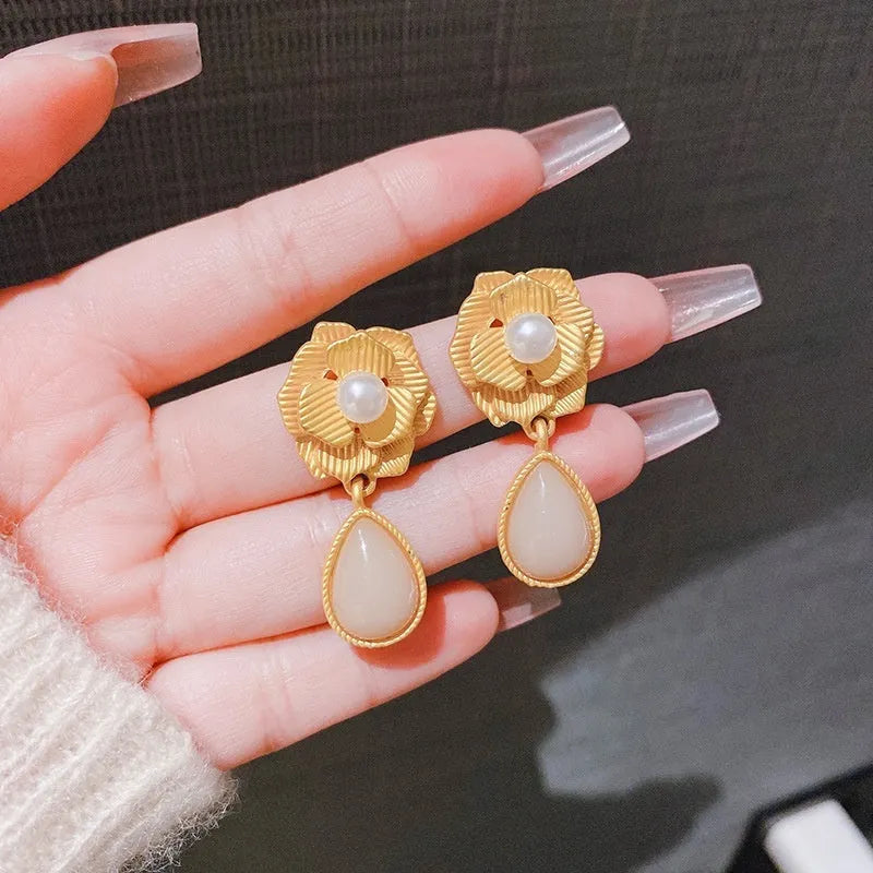 Gold electroplated sterling silver stud earrings with needle rose pearl design and opal stone accents