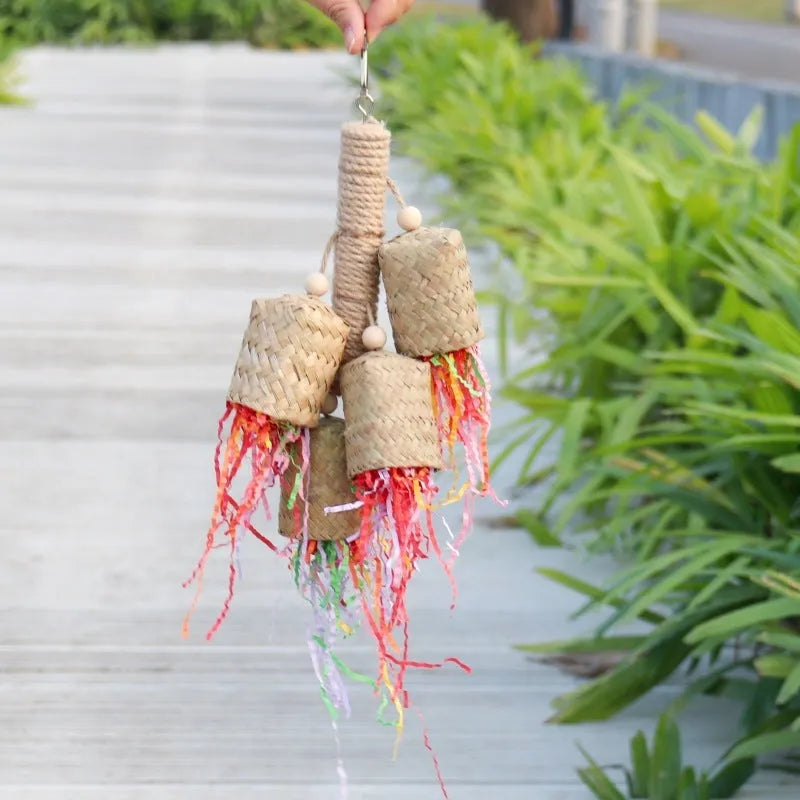 Wood and sisal parrot toy with colourful shredded paper centre for biting and foraging.