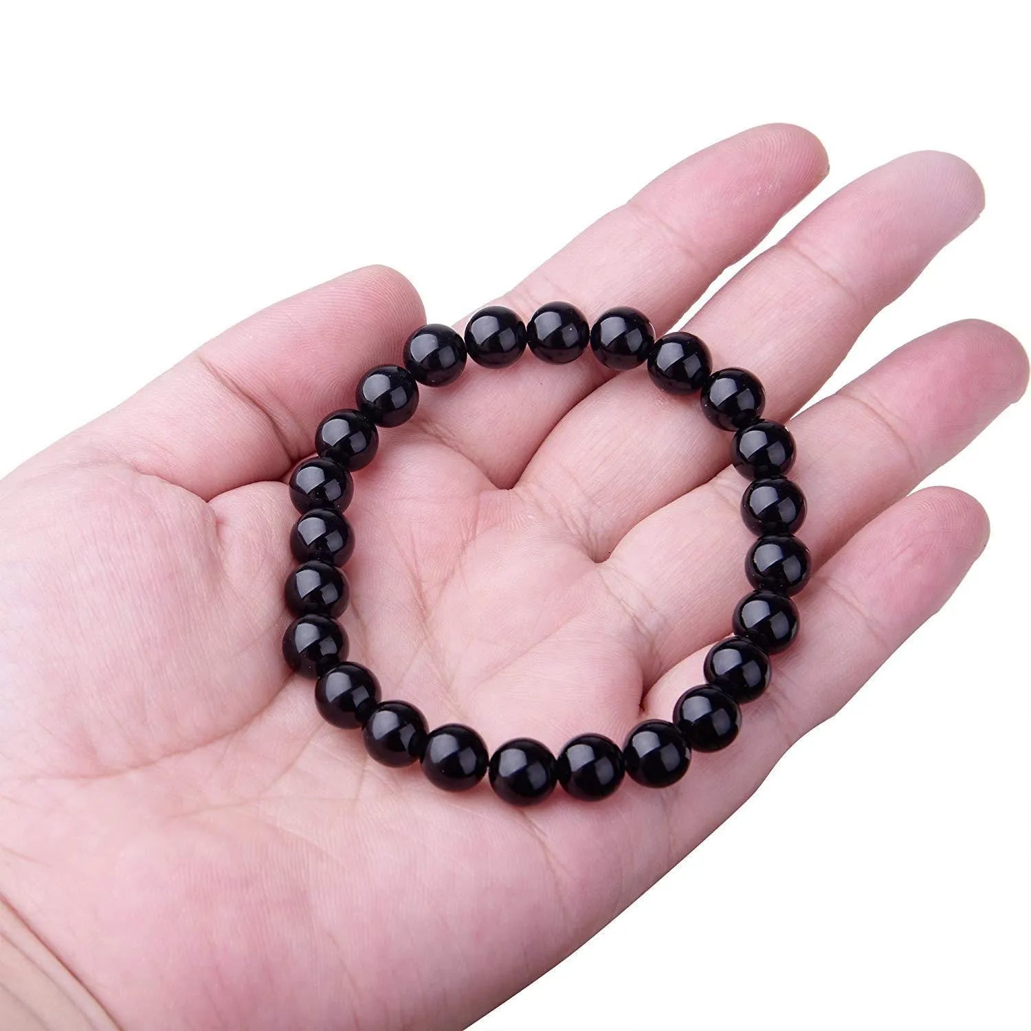 Geometric black onyx bracelet with 8mm beads on a black elastic cord.