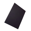 Heat-insulating laptop pad in black, gold, blue, and green colours on a desk