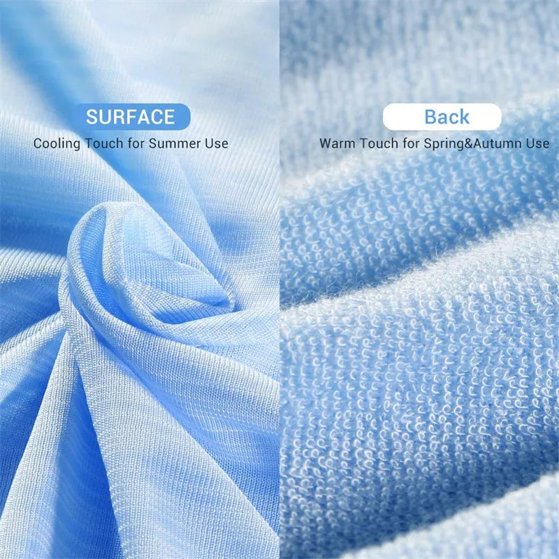 Blue Japanese cooling blanket with Q-Max fibres laid flat on a bed.