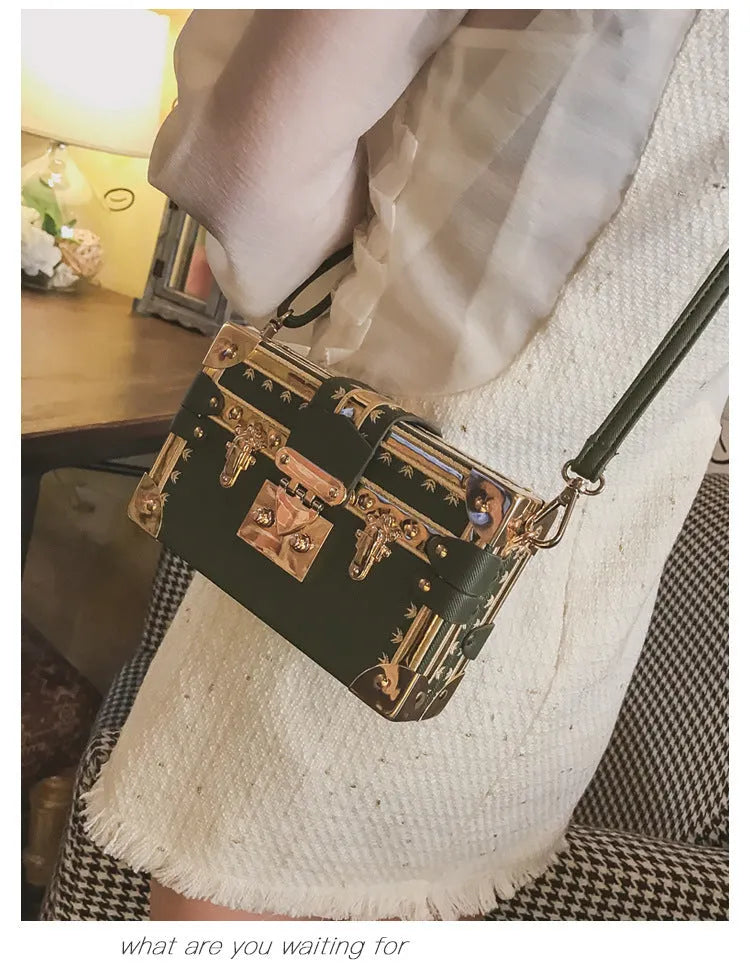 Hard-case women's shoulder bag with flap design, rivet decoration, and adjustable crossbody strap