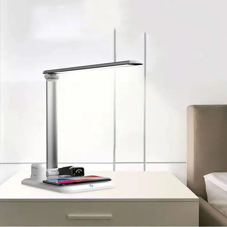 Black and white 4-in-1 LED desk lamp with wireless charging pad and USB Type-C port