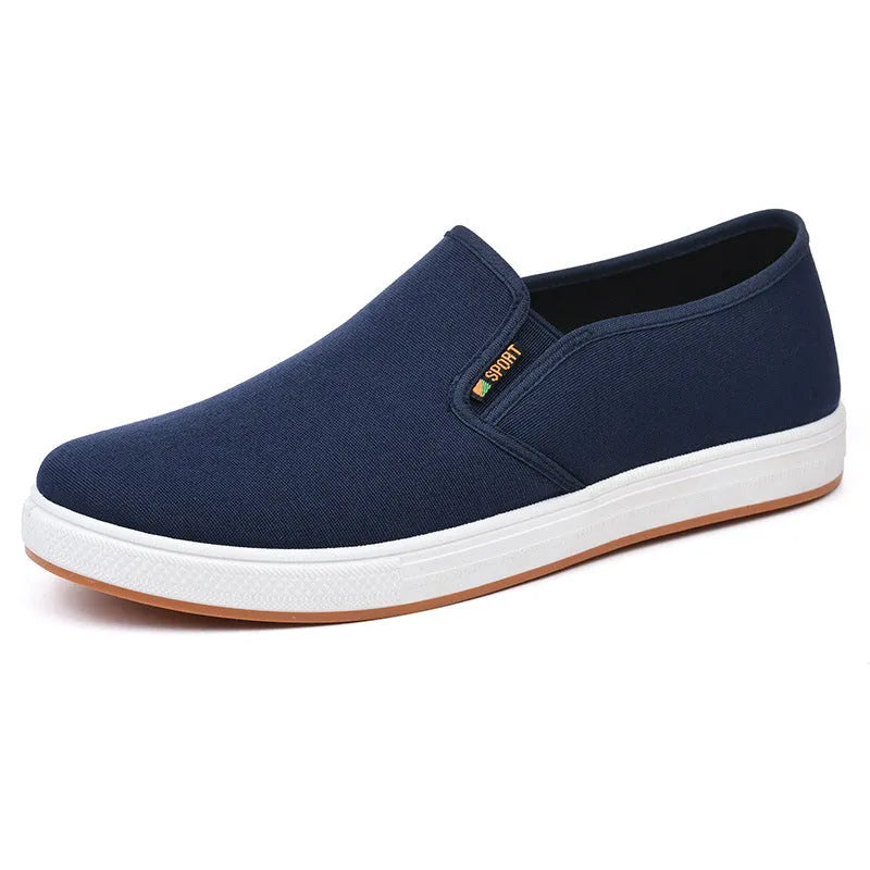Men's black and blue canvas slip-on shoes with round toe design and composite soles