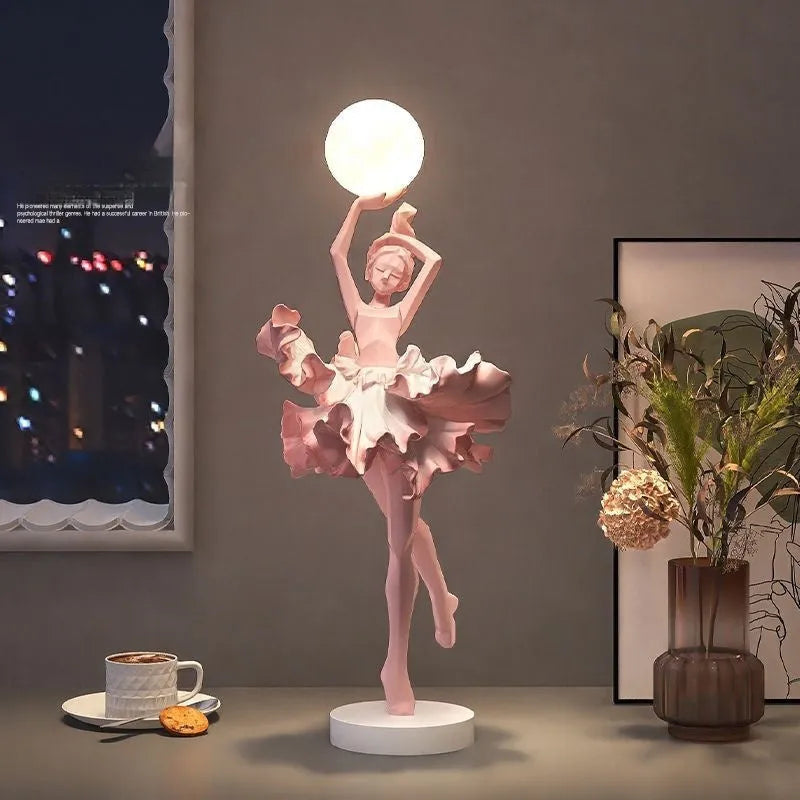 Small resin night light ornament in black gold colour with USB charging cable