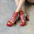 Fish mouth Roman block heel ankle boots in snake skin material available in black, red and white colours