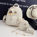Women's three-piece PU leather bag set showing backpack, shoulder bag, and card holder in matching colour