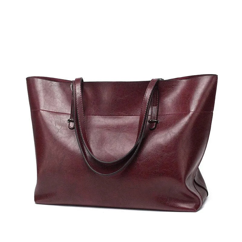 Women's wax cowhide leather handbag with horizontal silhouette and cross-body strap
