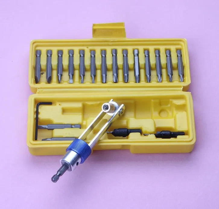 Half Time Drill driver tool with set of Phillips, flathead, and countersink bits on a workbench.