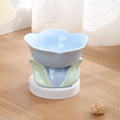 Blue and pink floral patterned ceramic raised pet bowl with non-slip base for cats and small dogs