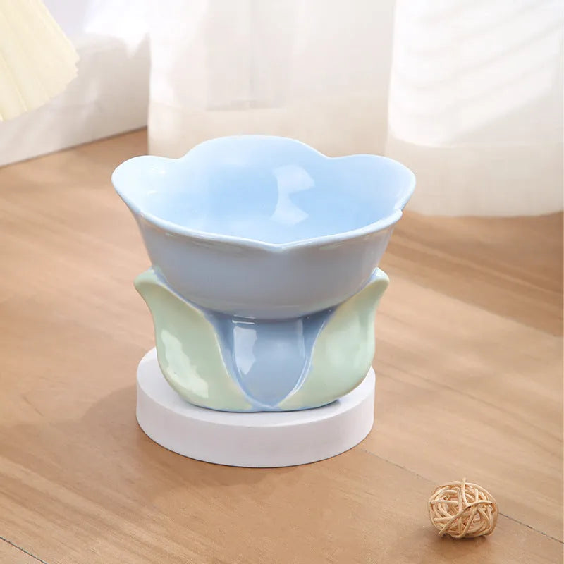 Blue and pink floral patterned ceramic raised pet bowl with non-slip base for cats and small dogs