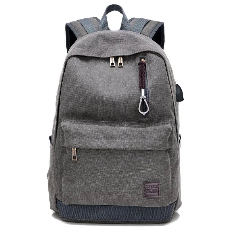 Canvas USB rechargeable backpack in grey showing front pocket and shoulder strap