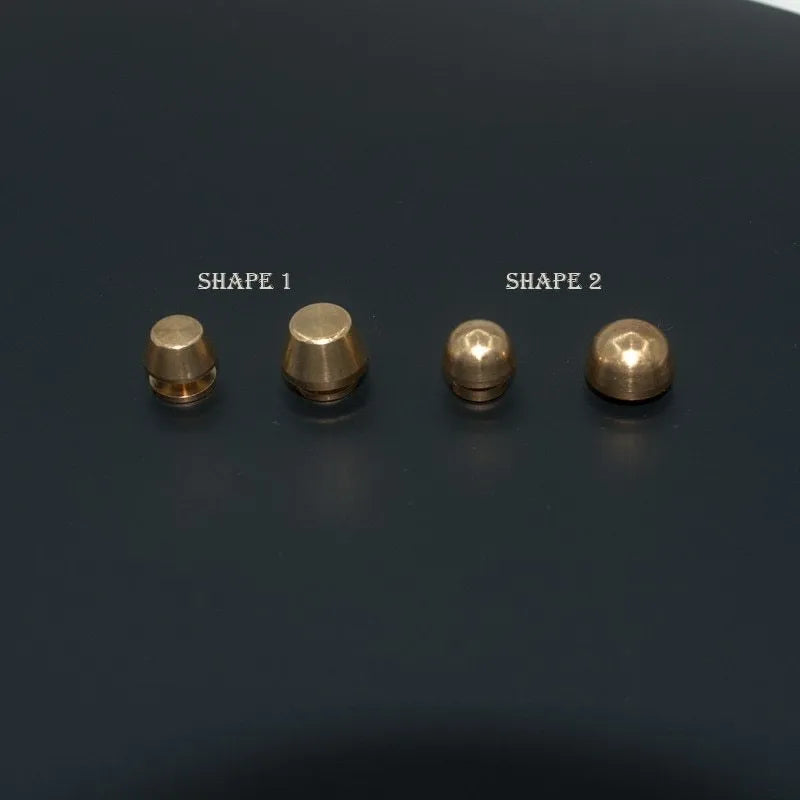 Brass decorative buckle with geometric and round foot nail designs in 10x6mm and 12x7mm sizes.