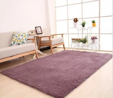 Solid colour plush area rug with non-slip dot-patterned bottom in rectangular shape