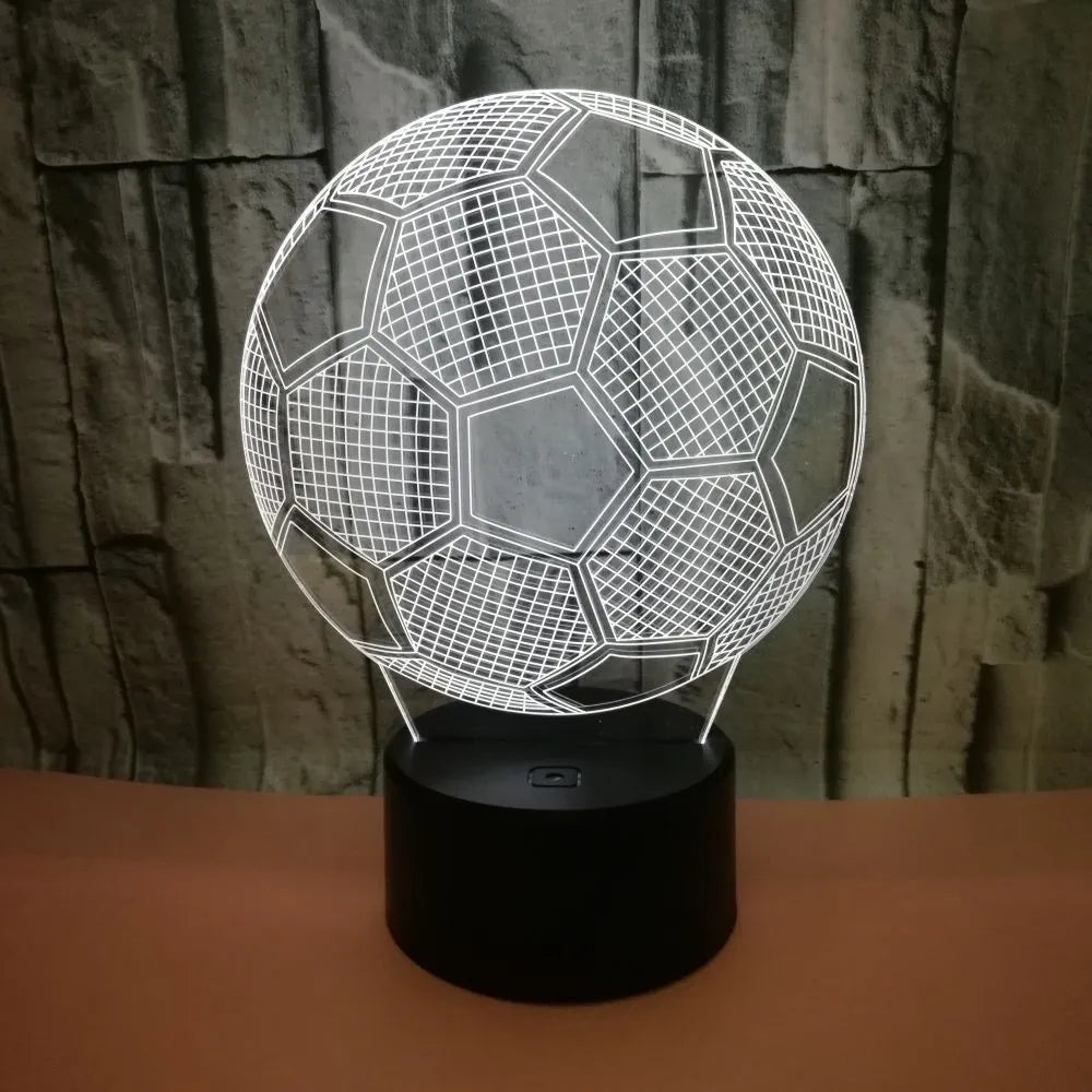3D football-shaped LED night light showing colour gradient on acrylic panel with touch control base.