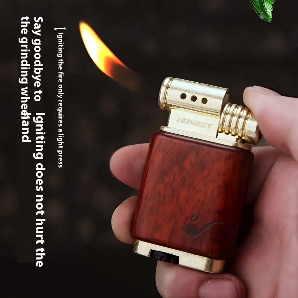 Ebony gas lighter with carved rosewood good luck design on a metal body.