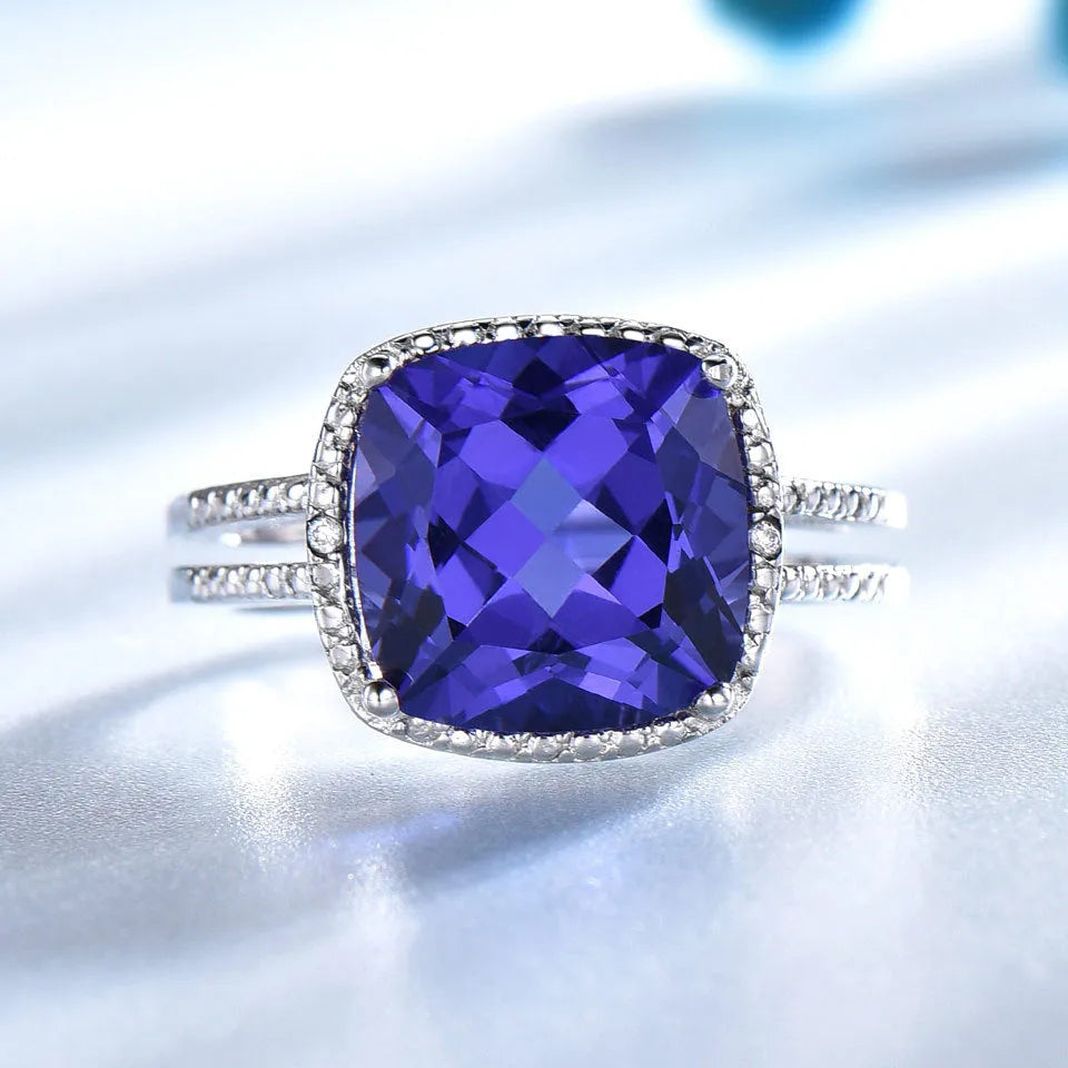 Blue tanzanite gemstone set in a sterling silver women's ring.