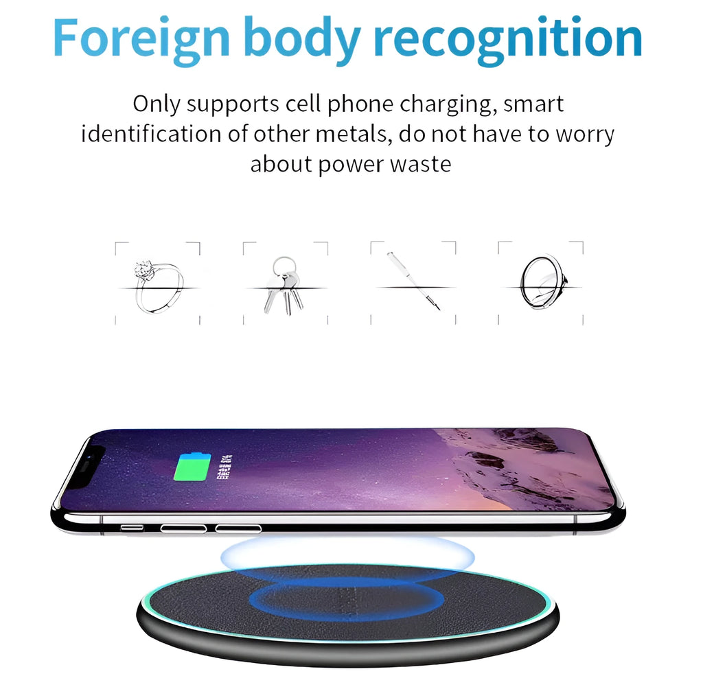 Black Qi wireless charging pad for iPhone 11 placed on a wooden surface.