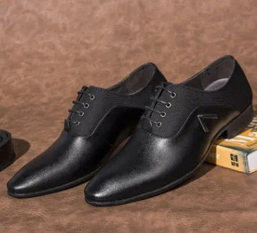 Men's black Oxford shoes with artificial PU leather upper and rubber sole on a white background.