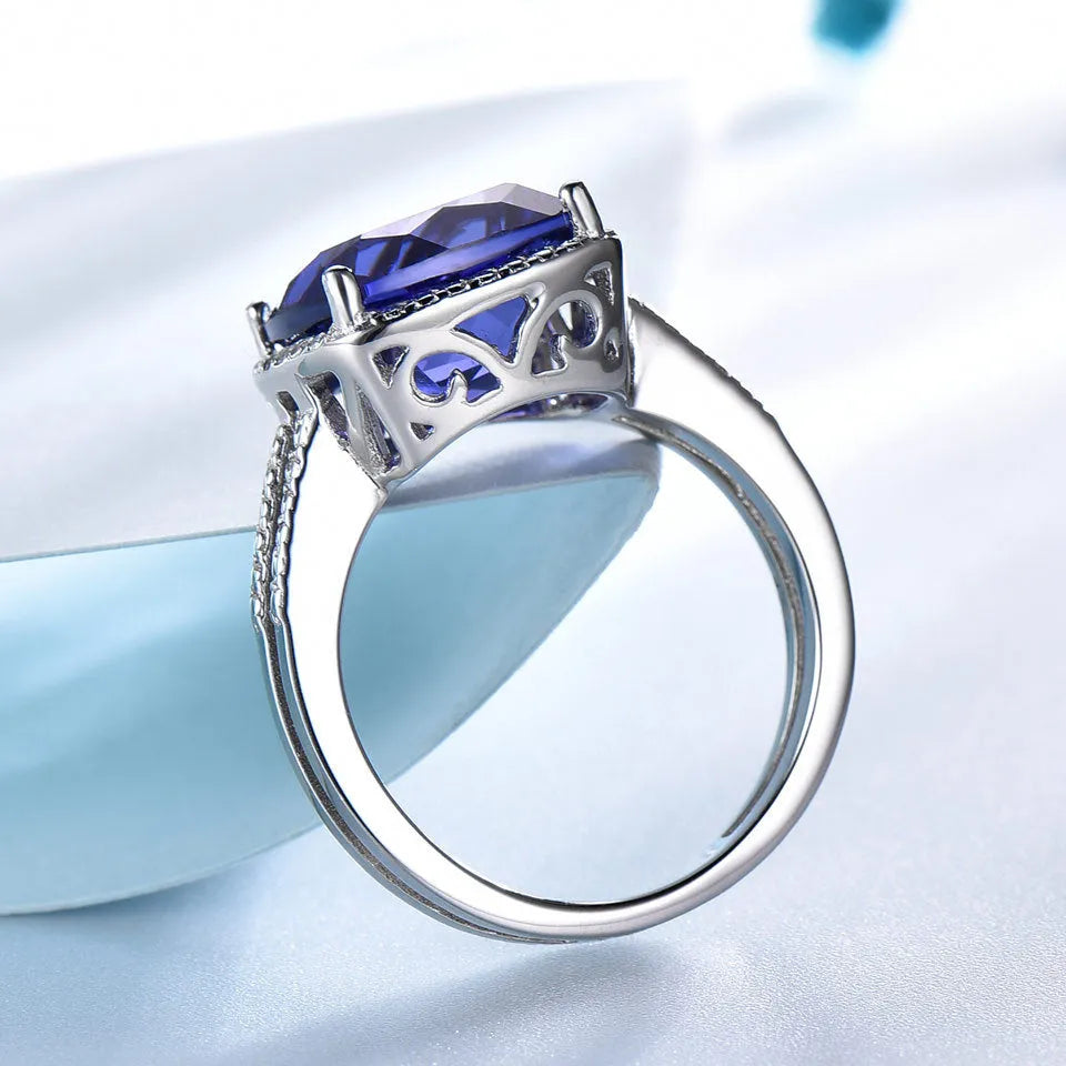 Blue tanzanite gemstone set in a sterling silver women's ring.