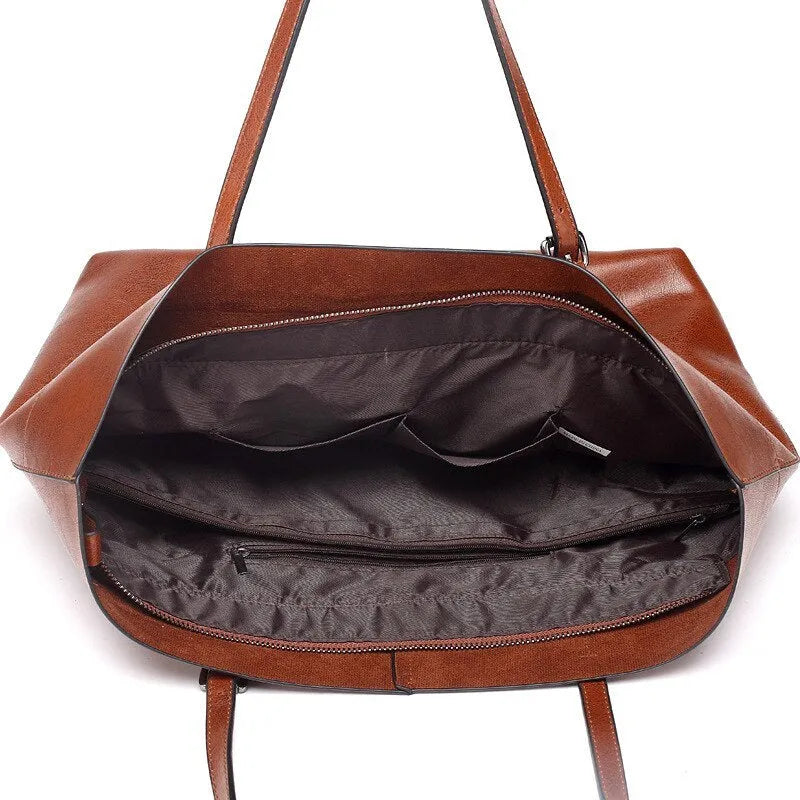 Women's wax cowhide leather handbag with horizontal silhouette and cross-body strap