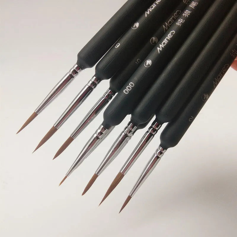 Set of ten black wolf hair hook liner brushes with wooden handles and steel ferrules arranged by size