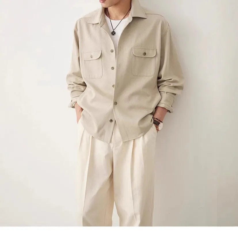 Men's light sand rice coloured cotton blend lapel shirt laid flat, showing long sleeves and simple collar design.