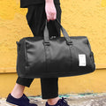 Black waterproof sports bag with side shoe compartments showing diagonal straps and two size options