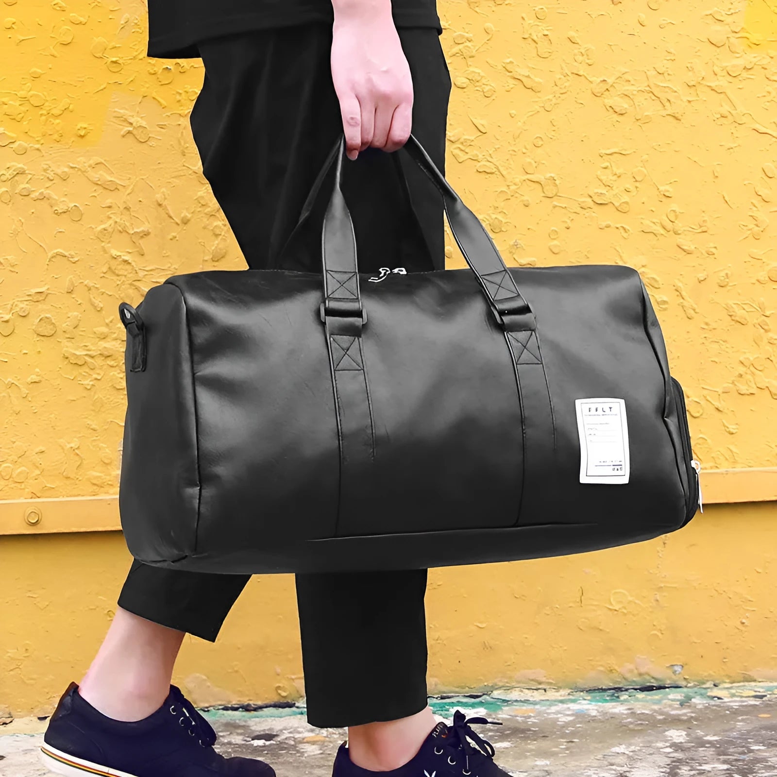 Black waterproof sports bag with side shoe compartments showing diagonal straps and two size options