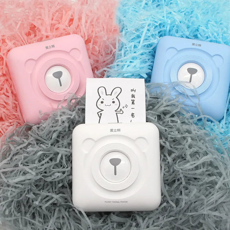 Portable mini thermal label printer in white, 7.9 x 7.9 x 4.2cm, with rechargeable battery and thermal paper roll