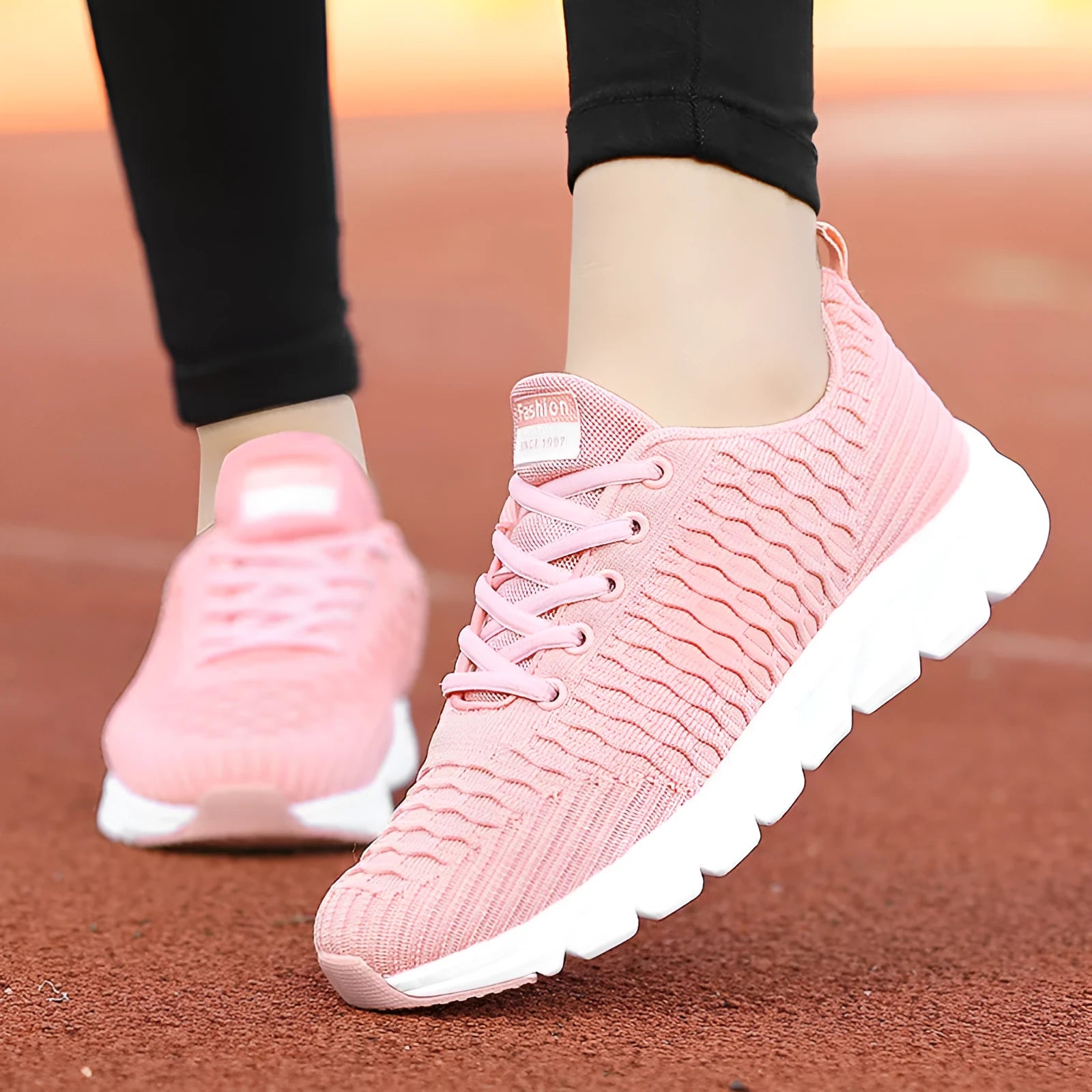 Women's running shoes in black pink white colours with fly weaving upper and wear-resistant outsole